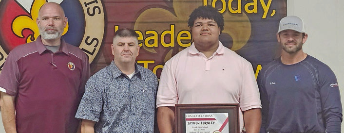 Turnley honored at school board