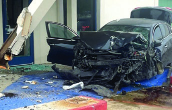Motorist smashes into medical building, hospitalized