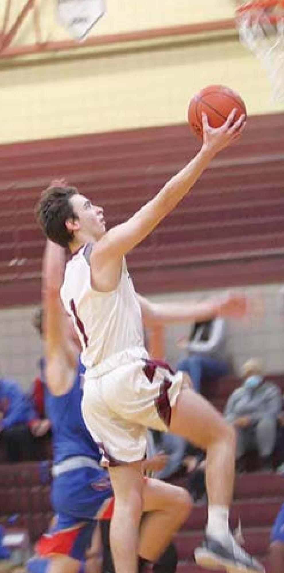 Dogs run past Lake Arthur 80-37