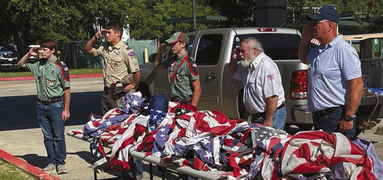 Formal burning ceremony retires old flags