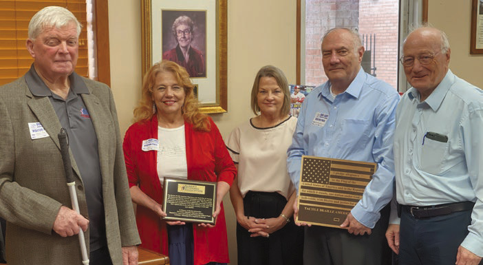 Bronze braille flag dedication honors lifelong librarian 