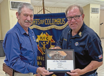 Grand Knight Mason LeJeune (left) and KC Tommy Dennis