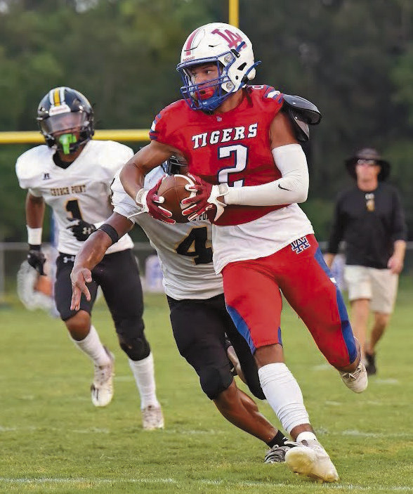 Tigers chop down Basile, 34-12