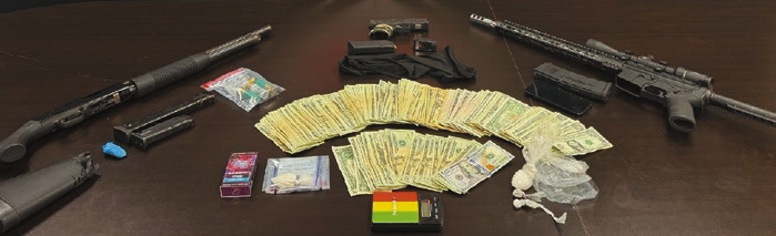 An armed robbery and kidnapping report led Jennings Police Department to a home on Airport Road where narcotics, weapons, paraphernalia and money were discovered and seized. Both suspects in the case are currently being held in the parish jail. Submitted photo