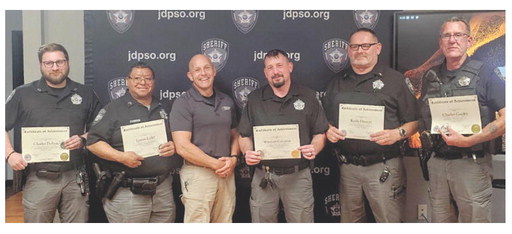 Sheriff Kyle Miers recently honored several of his deputies who went above and beyond to assist the department with emergency jury summonses. Deputy Charles Duhon (from left), Deputy Lennis Ledet, Miers, Deputy Winston Coleman, Deputy Keith Doucet and Deputy Charles Guidry celebrated the occasion. Deputy Tiffany Bertrand was also highlighted but unable to attend. Daily News photo by Erin Hargrave