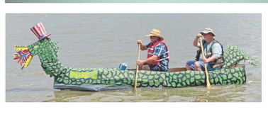 Puff the Magic Dragon carries two contestants through the lake. The Lake Arthur Freedom Fest boat races will be returning to the festivities this year. File photo