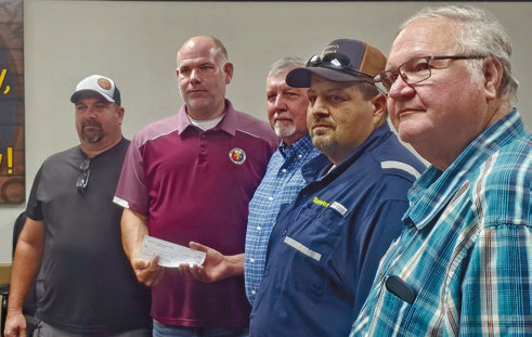 Cattlemen’s Association makes donation to parish schools