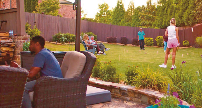 Few things bring the fun to summer parties like a backyard game space.