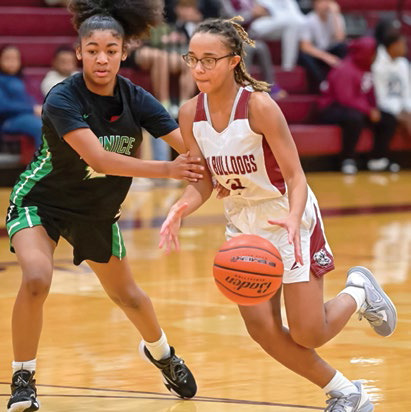Lady Dogs outscore Charging Indians 51-48