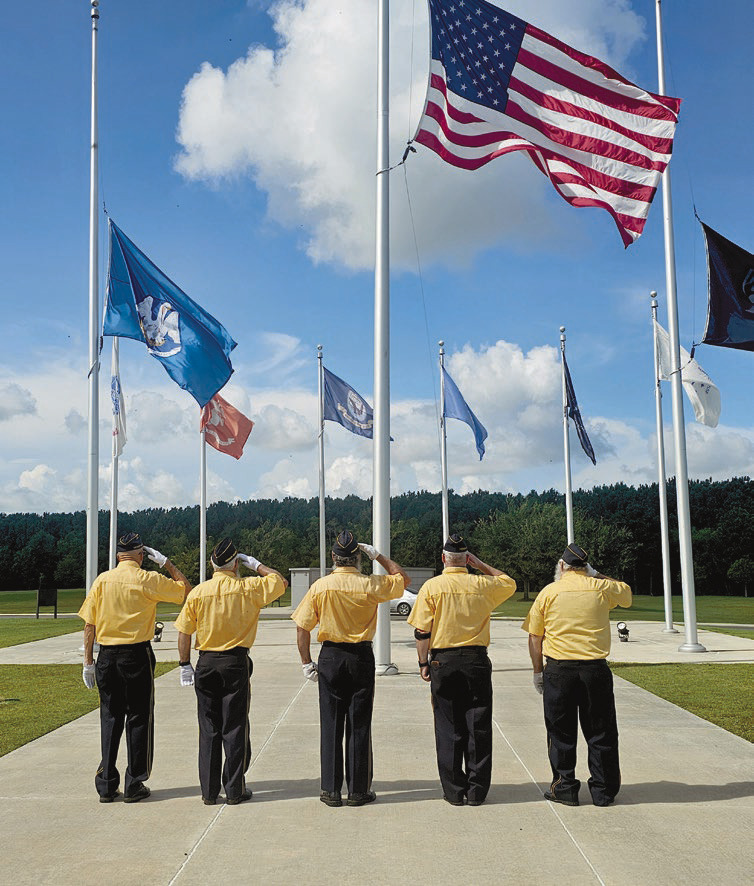 Members of the James O. Hall Post 19 American Legion Honor Guard take a moment to salute and honor those who lost their lives on Sept. 11, 2001, and in the wars that followed. Today marks the 25th anniversary of the deadliest terrorist attack in modern history and the worst to occur on American soil. Daily News photo by Erin Hargrave