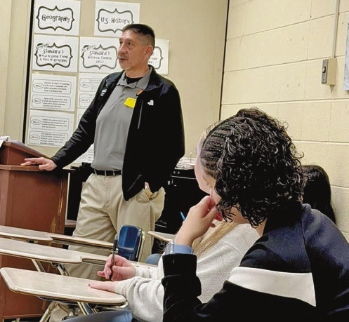 John shares knowledge with area students