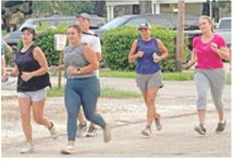 Newly formed running and walking group, J-Town Joggers, hits the streets of downtown Jennings early Saturday morning. Coordinator Carter Prejean said she started the group to provide a free, social outlet for getting exercise and supporting overall health. Updates on running dates, location and times are posted on the J-Town Joggers Facebook page. Daily News photo by D'Arcy Knight