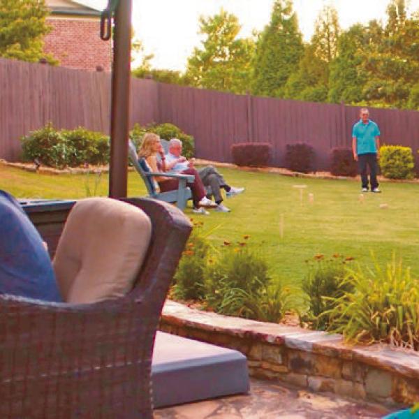 Few things bring the fun to summer parties like a backyard game space.