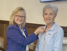 District Gov. Margaretta Mayes (left) and Rotarian and President-Elect Bernadine Daboval
