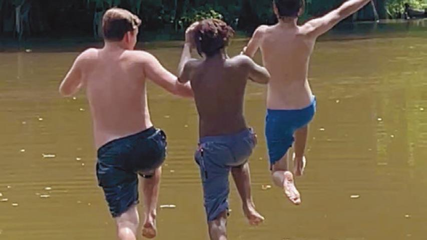 Aiden Michon (from left), 13, Jathaniel Arvie, 11, and Trenton Michon, 13, take a running jump off the dock at Houssiere Park as the three friends from Jennings take full advantage of the warm summer days. Daily News photo by D'Arcy Knight