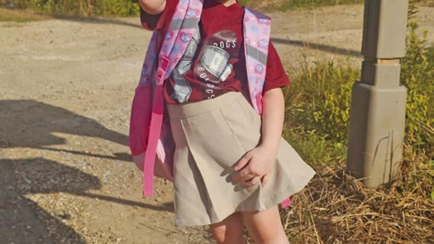 Arabella Istre, 4, eagerly scans the road for her school bus, excited to begin her very first day of school. Students filled parish schools Friday as the 2026-27 year kicked off in Jeff Davis Parish. Daily News photo by Erin Hargrave