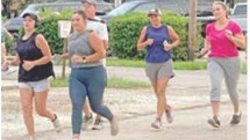 Newly formed running and walking group, J-Town Joggers, hits the streets of downtown Jennings early Saturday morning. Coordinator Carter Prejean said she started the group to provide a free, social outlet for getting exercise and supporting overall health. Updates on running dates, location and times are posted on the J-Town Joggers Facebook page. Daily News photo by D'Arcy Knight
